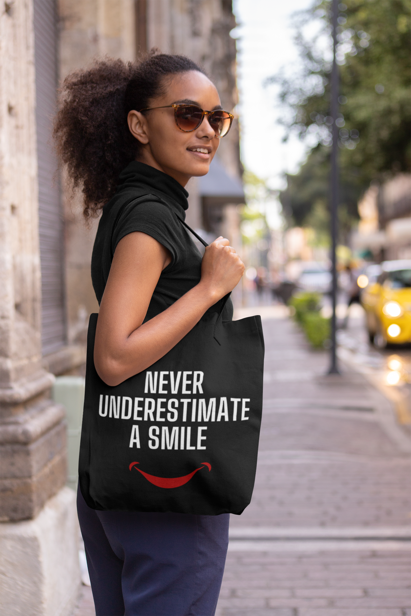 Never Underestimate a Smile Tote Bag