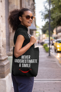Never Underestimate a Smile Tote Bag