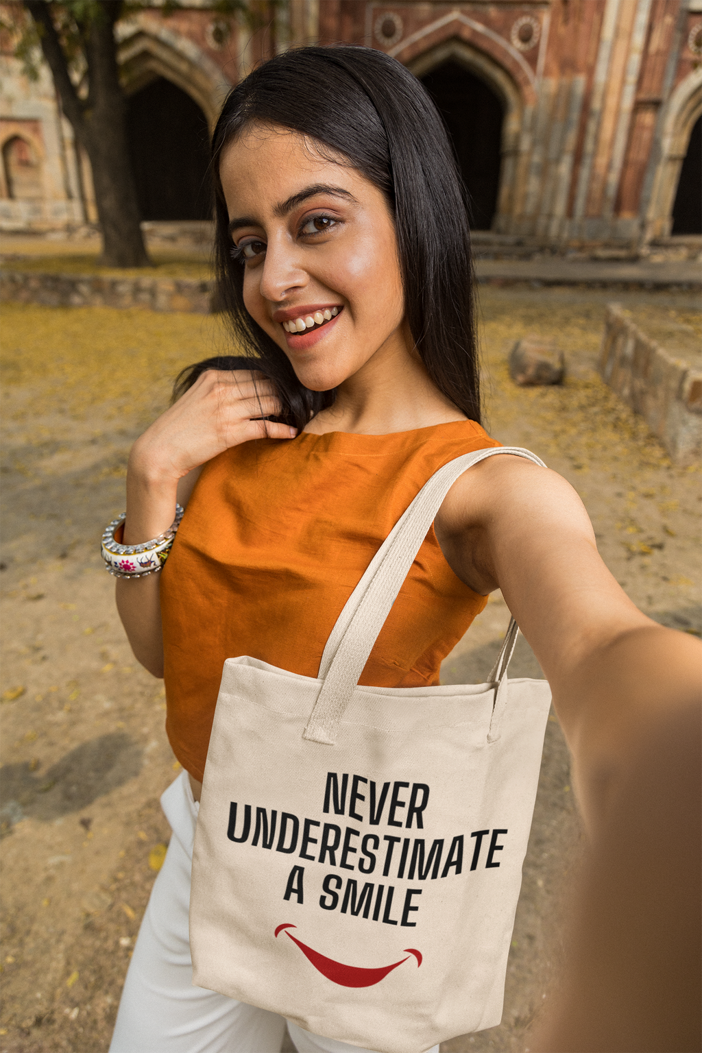 Never Underestimate a Smile Tote Bag