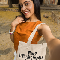Never Underestimate a Smile Tote Bag
